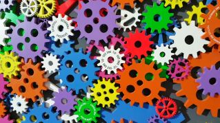 A colorful arrangement of gears symbolizing creativity, innovation, and machinery in vibrant colors.